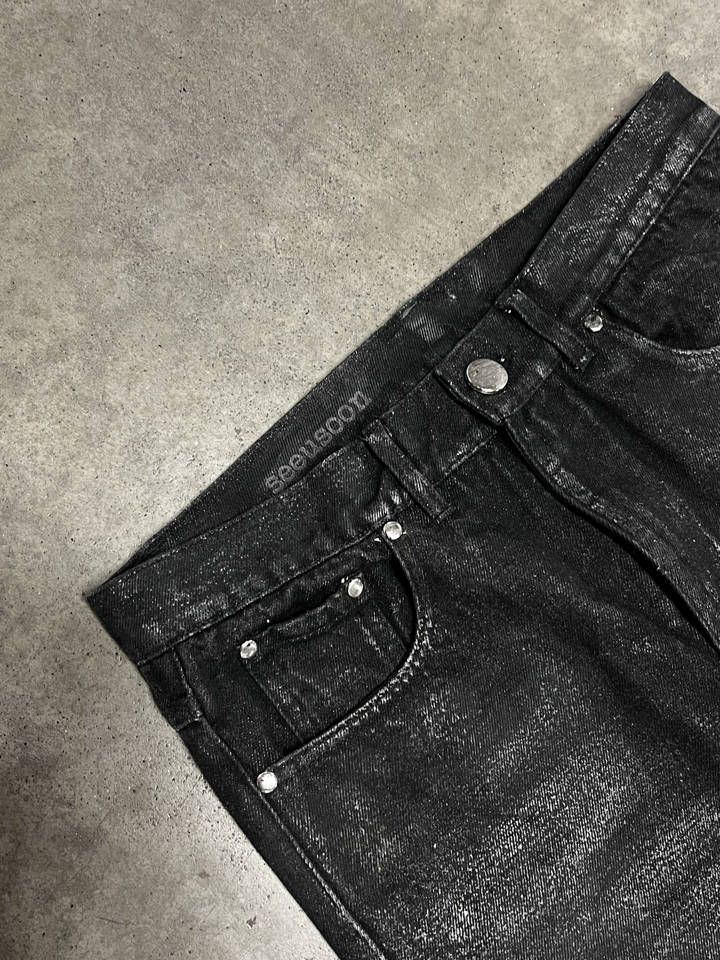 WAXED FLARED JEANS